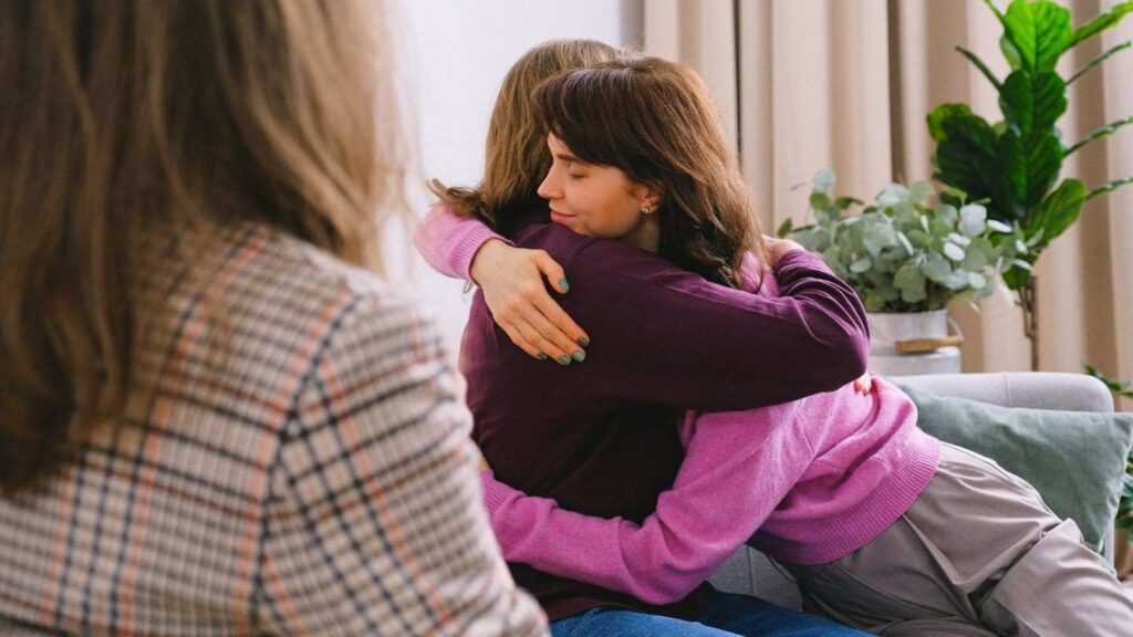 woman hugging her therapist